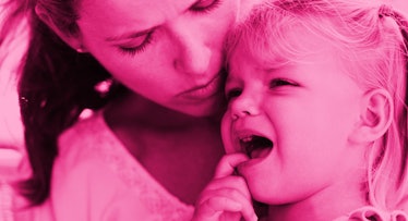A mother holding a child with an open mouth and in pain because of canker sores