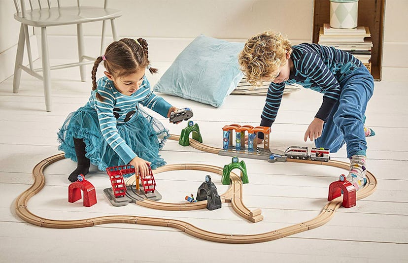 Two kids playing with Brio’s new smart train set