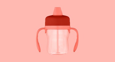 sepia edit of a two-handled baby sippy cup against a pink background