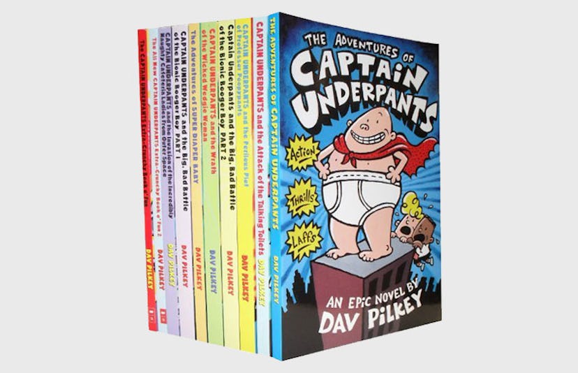 The books from The Captain Underpants Series by Dave Pilkey all stacked up against each other 