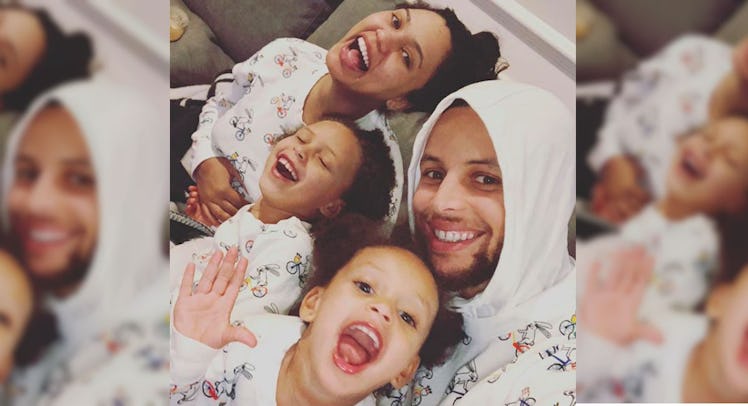 A selfie of Steph Curry with his wife and his two daughters