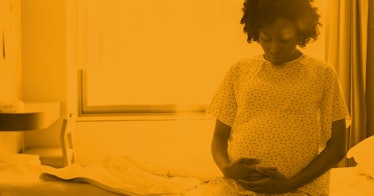 Orange edit of a pregnant woman in a hospital holding her baby bump