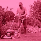 A lawn guy mowing his lawn with a pink color filter
