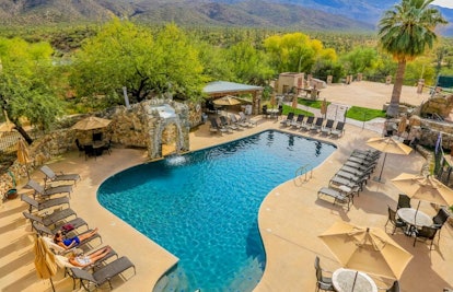The outside view of a swimming pool at the Tanque Verde Ranch