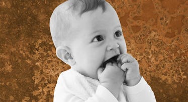 black and white photo of a baby eating poop or dirt against a brown background