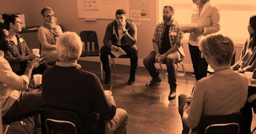 A group of people sitting in a circle during an anger management class