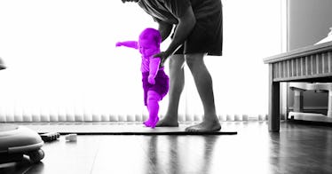 grey scale edit of a man helping a baby to walk