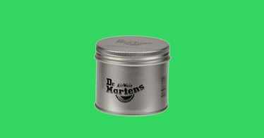 Dr. Martens Wonder Balsam in a silver package in front of a green background