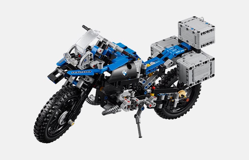 Lego BMW R 1200 GS Adventure motorcycle in blue and black coloring, with three cargo containers in t...