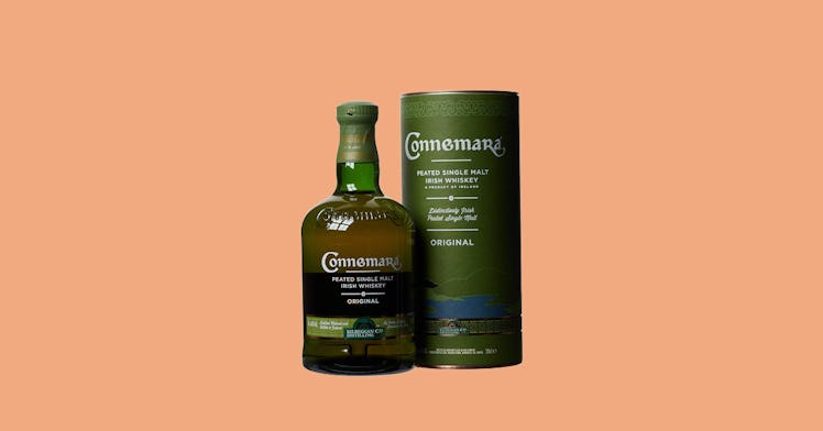 Connemara Single Malt next to its packaging on an orange background