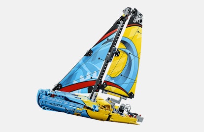 Lego Racing Yacht with yellow sails featuring a light blue wave as part of their design.
