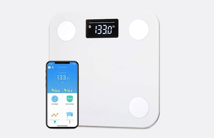 Yunmai Smart Bluetooth Scale and a phone displaying results 