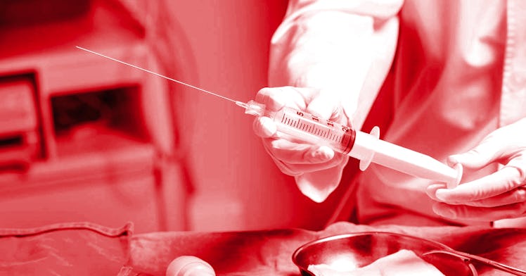 a black and red photo with someone holding a syringe