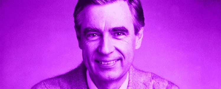 Mister Rogers wearing his iconic sweater and smiling at the camera