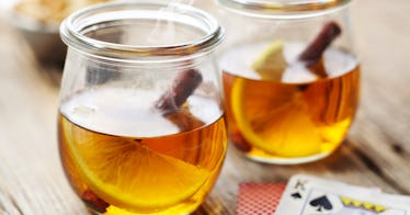 two hot toddies shown containing whiskey, cinnamon and lemon -- but do they cure the common cold?