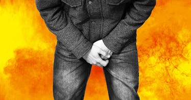 man holding his crotch in pain