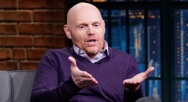 Bill Burr in a purple sweater at Late Night with Seth Meyers 