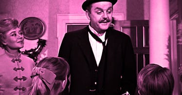 Mr Banks from Mary Poppins standing next to his wife and saying goodbye to his children as he goes t...
