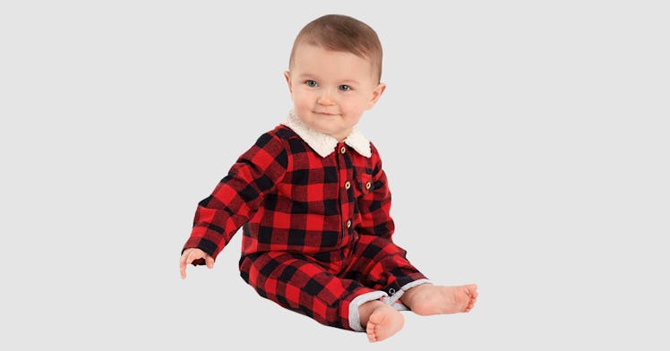 A baby in a Buffalo Check Sherpa One-Piece