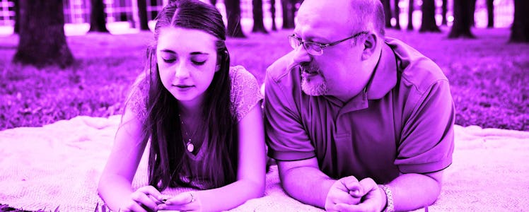 A little girl sitting next to her father asking him if her parents' divorce was her mom's fault with...
