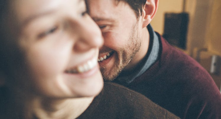 husband and wife smiling and laughing