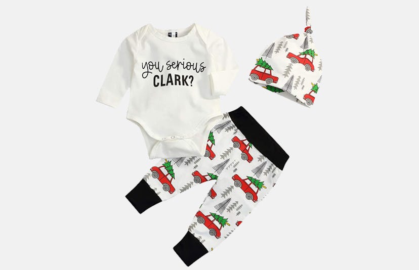 A baby bodysuit with "You Serious Clark?" written on it with pants and a hat with cars driving Chris...