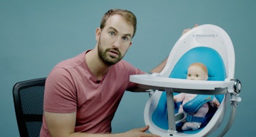 Evan Kaufman posing next to a doll in the Bloom Fresco High Chair 