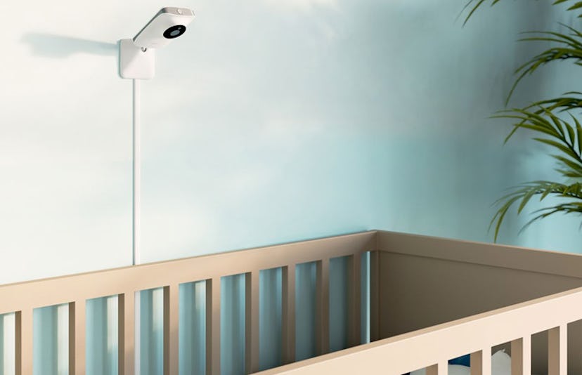A Miku cam placed next to a baby bed