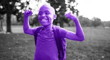 A child flexes their biceps.