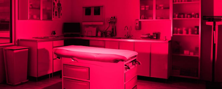 A hospital room with a bed in the middle for a vasectomy
