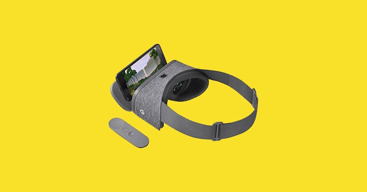 a vr headset is placed against a yellow backdrop