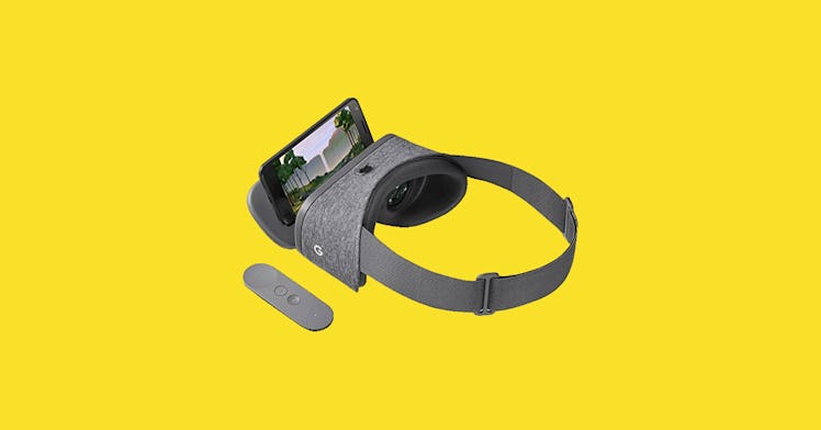 a vr headset is placed against a yellow backdrop