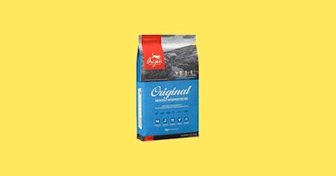 Dry Dog Food by Orijen on a yellow background