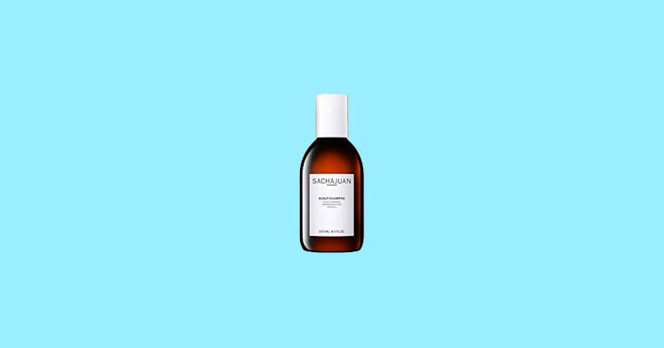 The Scalp Anti-Dandruff Shampoo by Sachajuan on a blue background