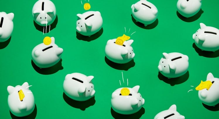 A lot of white piggy banks on a green background