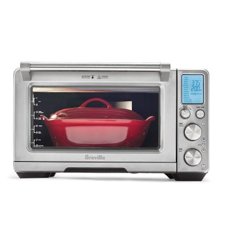 A red pot in a toaster oven