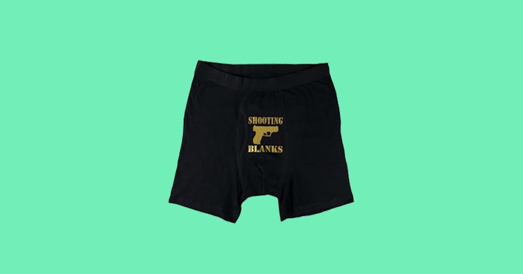 Black boxer- briefs that say "shooting blanks" and have a drawing of a gun all in gold