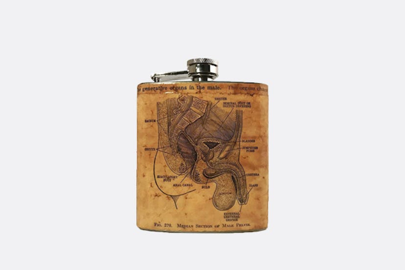 A Vintage Vasectomy Flask with a leather cover with the anatomy of male genitalia illustrated on it 