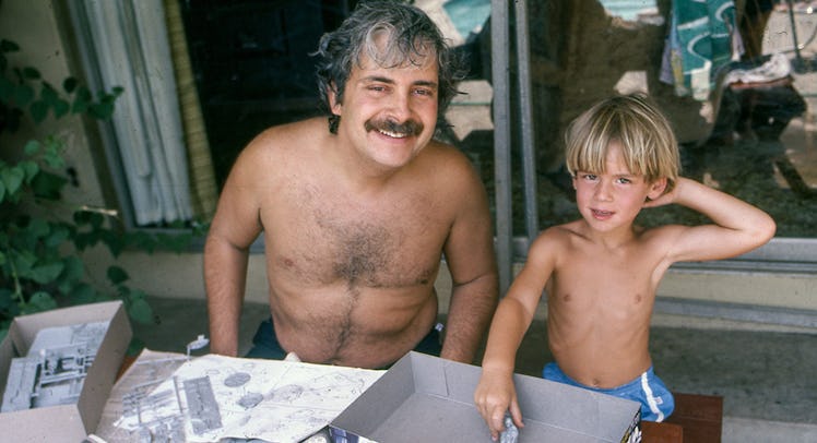 A dad and his son on a terrace