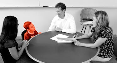 black and white edit of a parent-teacher conference showing a mother, father and kid, meeting with a...