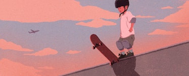 A little boy skateboarding with a helmet