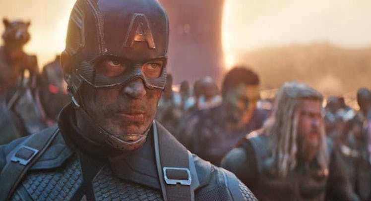 Captain America on the battlefield wearing a helmet with an "A" on it.