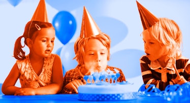 as two friends watch, a boy blows out candles on a cake at 6-year-old birthday party