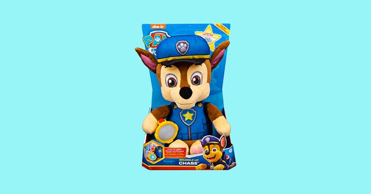 The Chase character from PAW Patrol as a stuffed animal on a blue background.