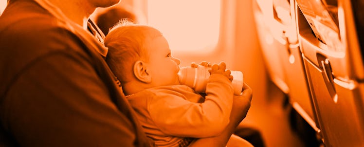 A man flying with his baby and an infant