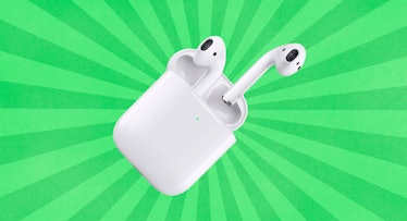 Air Pods on a two tone green striped background