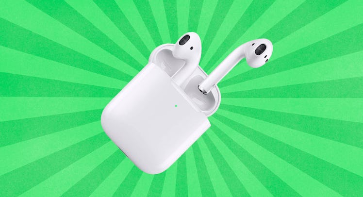 Air Pods on a two tone green striped background