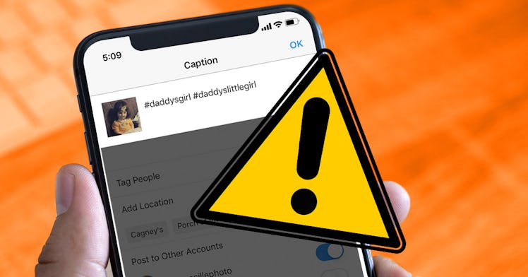 A hand holding a phone ready to post a picture with a bad hashtag, there is a sign with an exclamati...