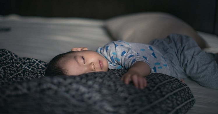 Toddler napping in sunlight.