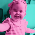 pink edit of one year old girl in striped shirt and bow headband laughing at dad's new years